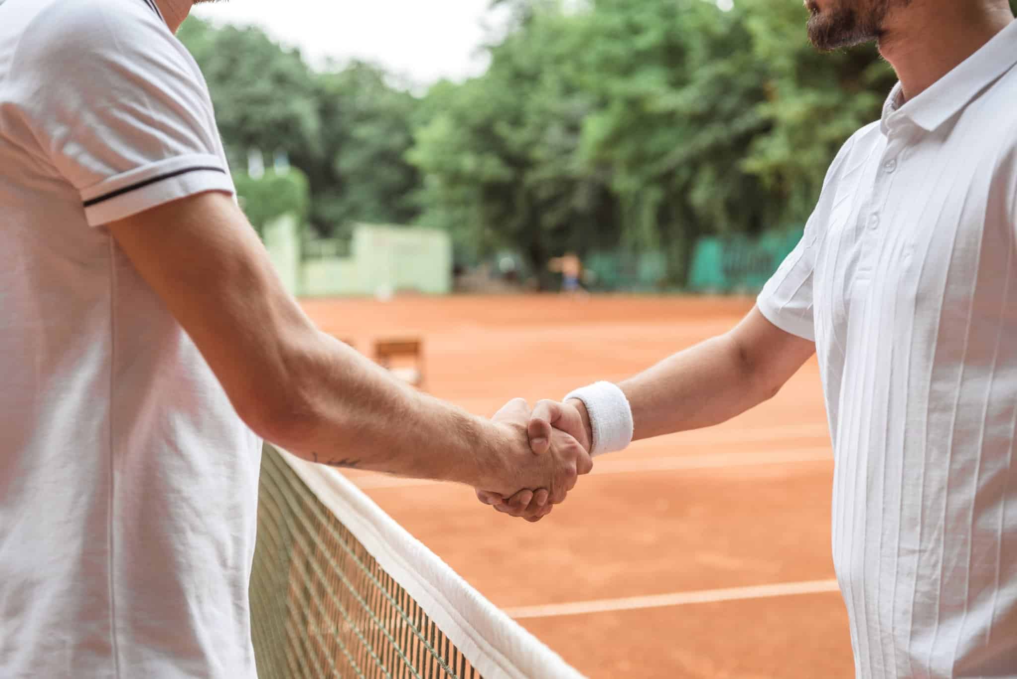 Two people shaking hands - Realize you Strategic Goals Faster with Wall and Main Advisors